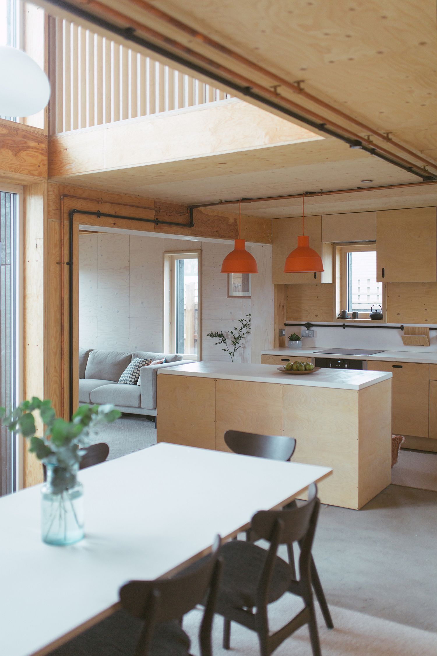 Open plan living area, kitchen and dining space of the Box House