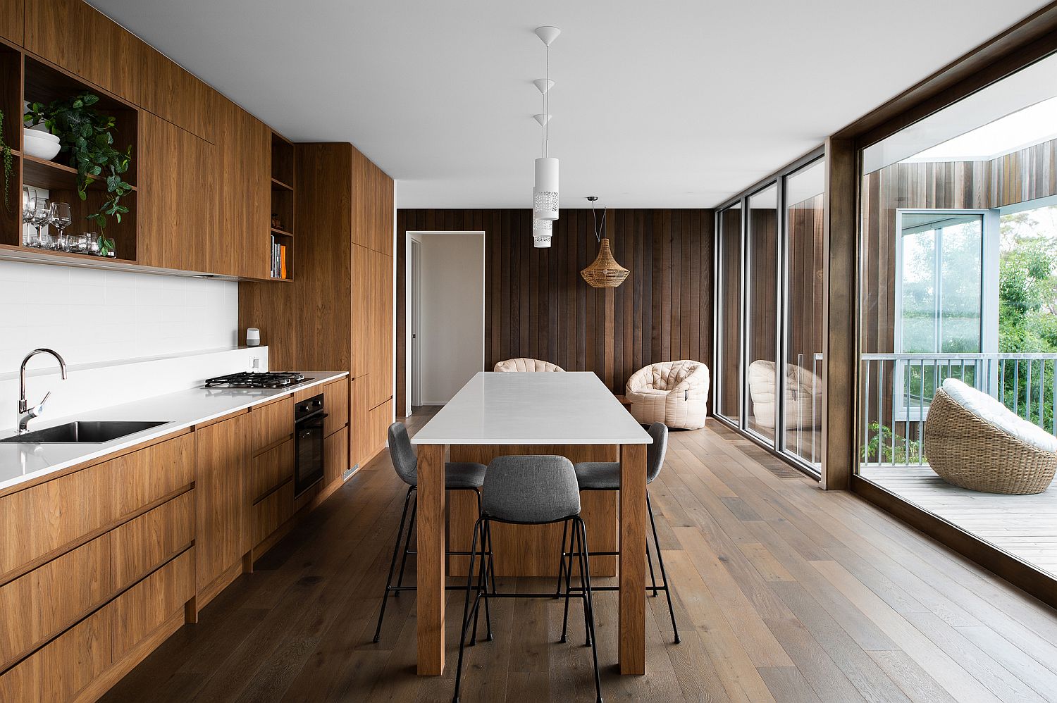 Reflective brilliance of sliding glass doors adds visual space to even the tiniest of kitchens