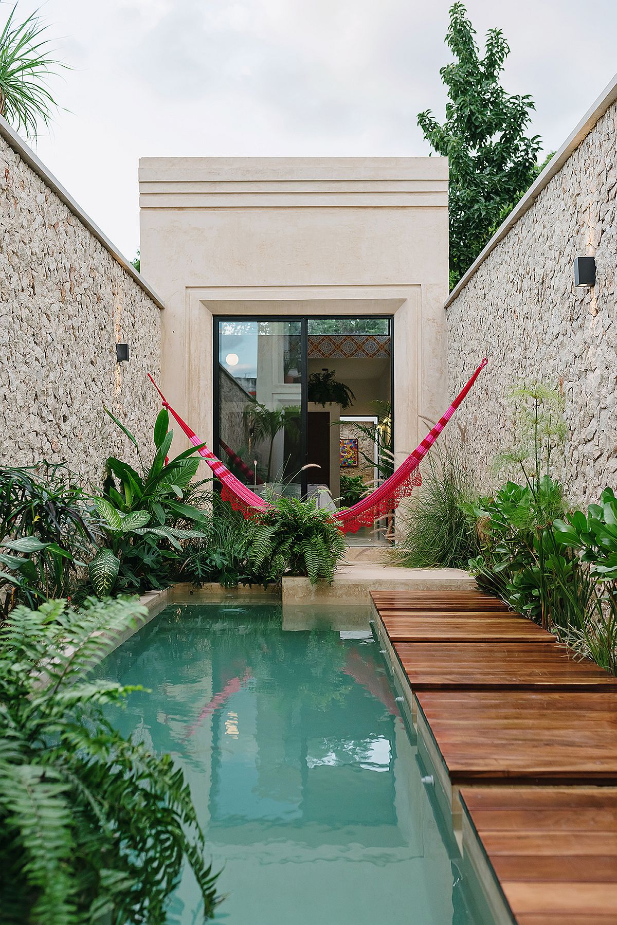 Relaxing rear wooden deck, pool area and hammock at Casa Picasso