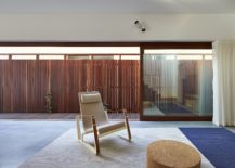 Sliding-glass-doors-coupled-with-woodsy-fence-outside-create-ample-privacy-217x155
