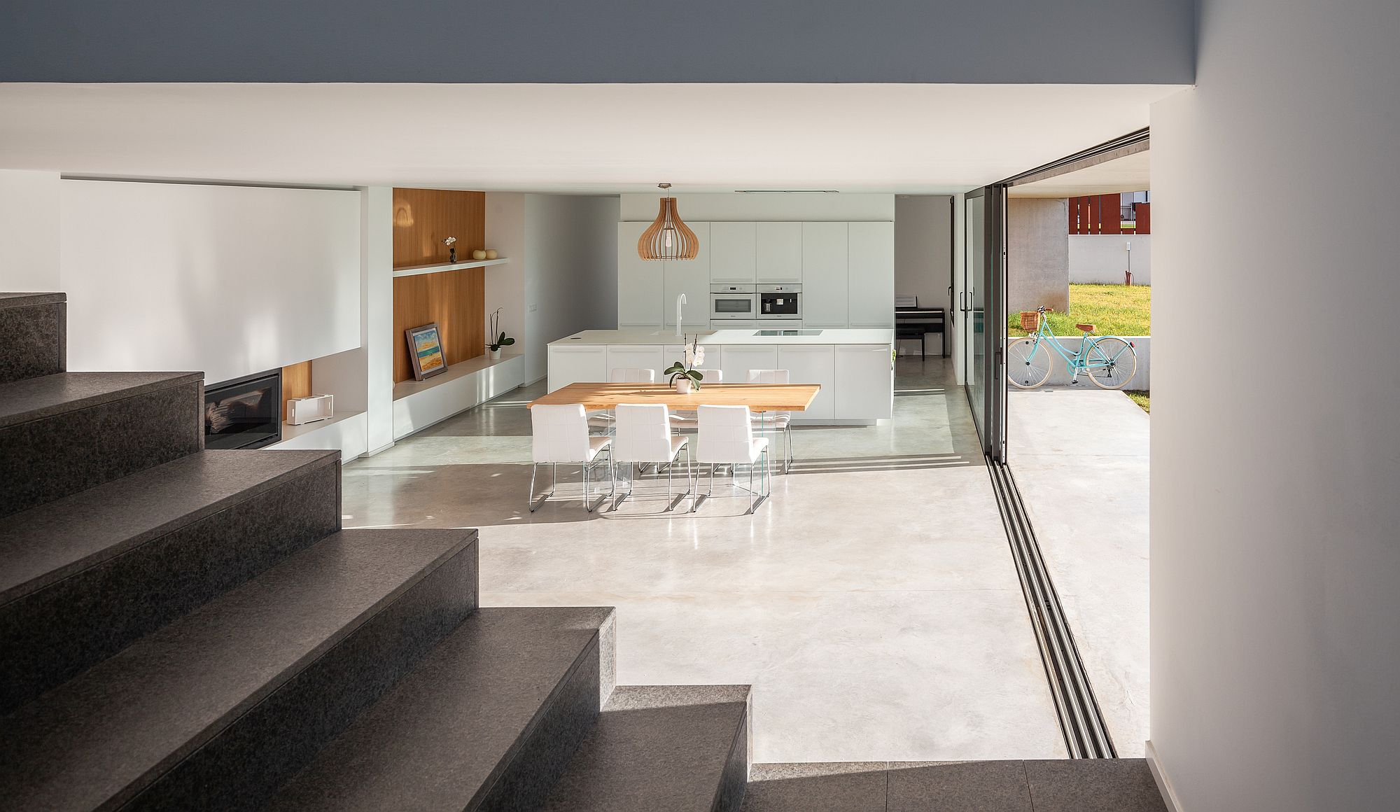 Sliding glass doors turn the modest kitchen into a spacious setting with colors of nature added to it