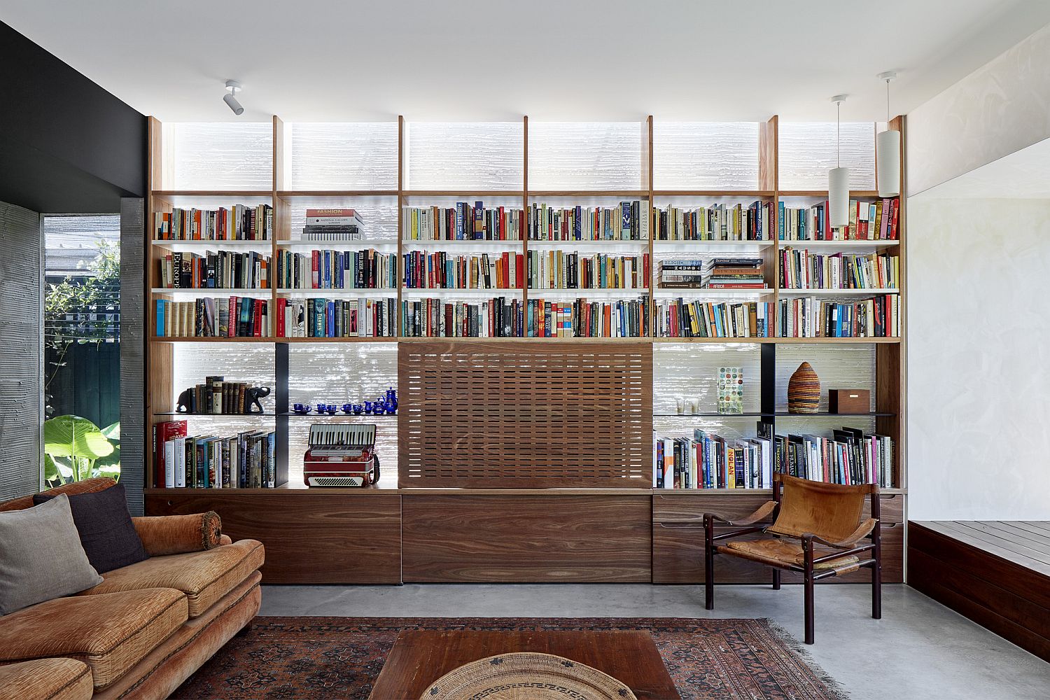 Sliding wooden door beautifully hides the TV behind it