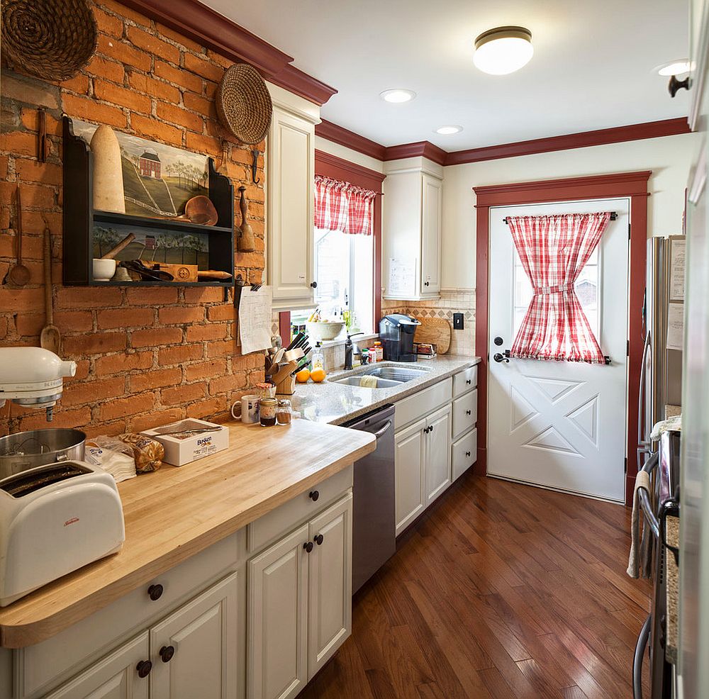 Small kitchen in white and brick with pops of red