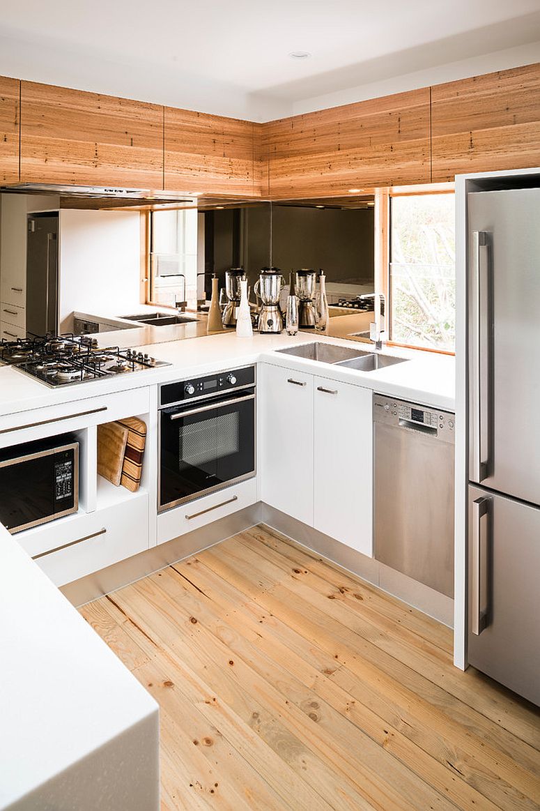 Small modern kitchen of Melbourne home with a mirrored backsplash