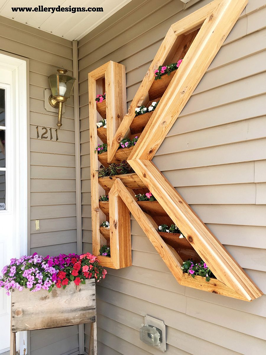 Smart DIY cedar monogram planter can be placed both at the entry and indoors