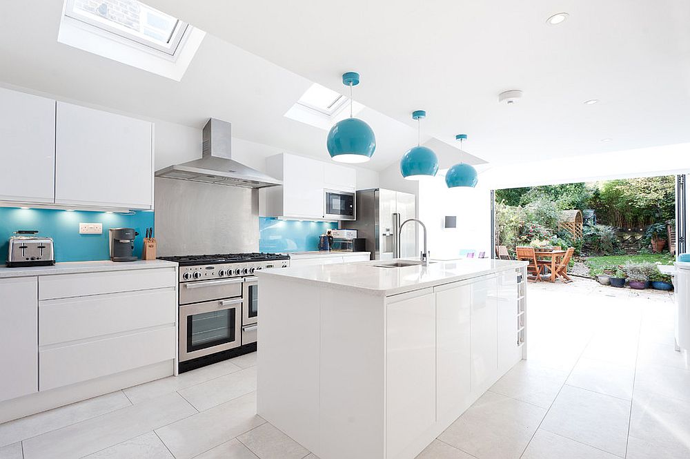 Stylish-and-urbane-kitchen-in-white-with-blue-backsplash-and-pendants