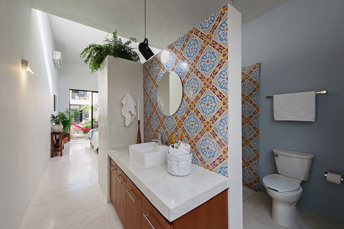 Tiles bring color and pattern to the bathroom in white