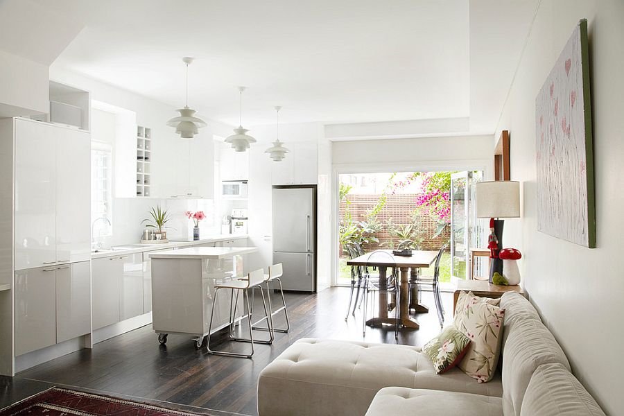 Tiny white kitchen island on wheels offers design flexibility along with contemporary style