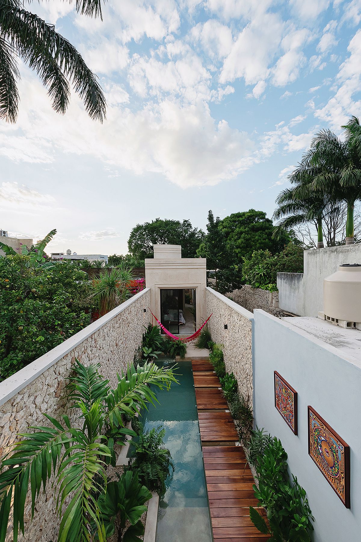 View-from-above-of-the-pool-area-and-the-narrow-house