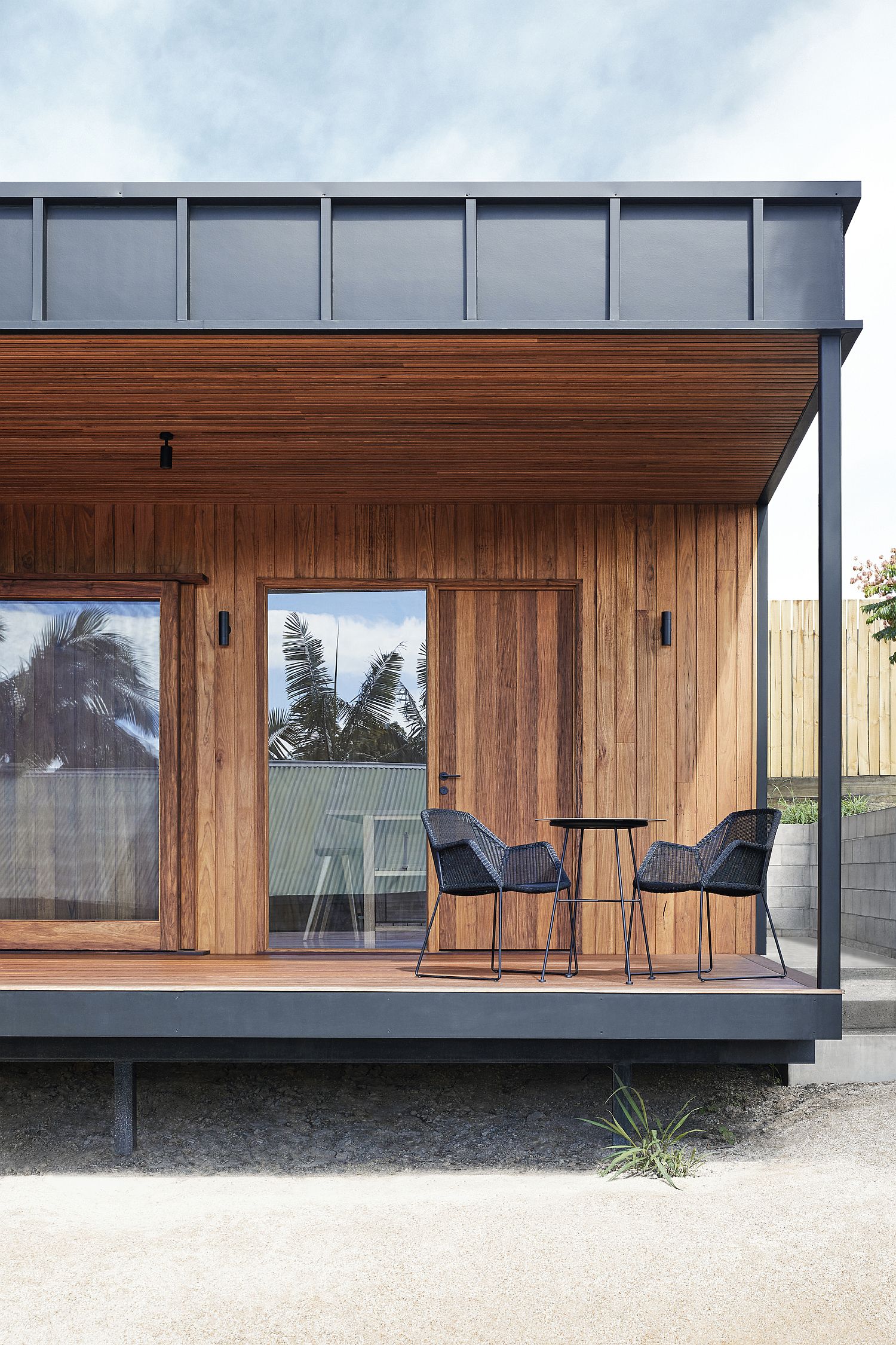 Warmth of wood stands in contrast to the drak metallic exterior