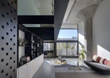 White-concrete-and-gray-living-area-of-the-spacious-home-217x155