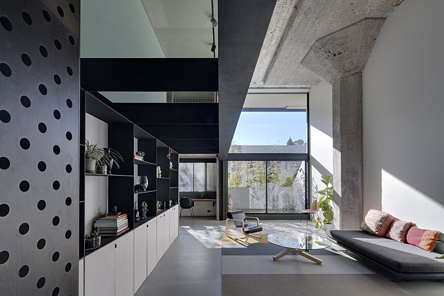 White, concrete and gray living area of the spacious home