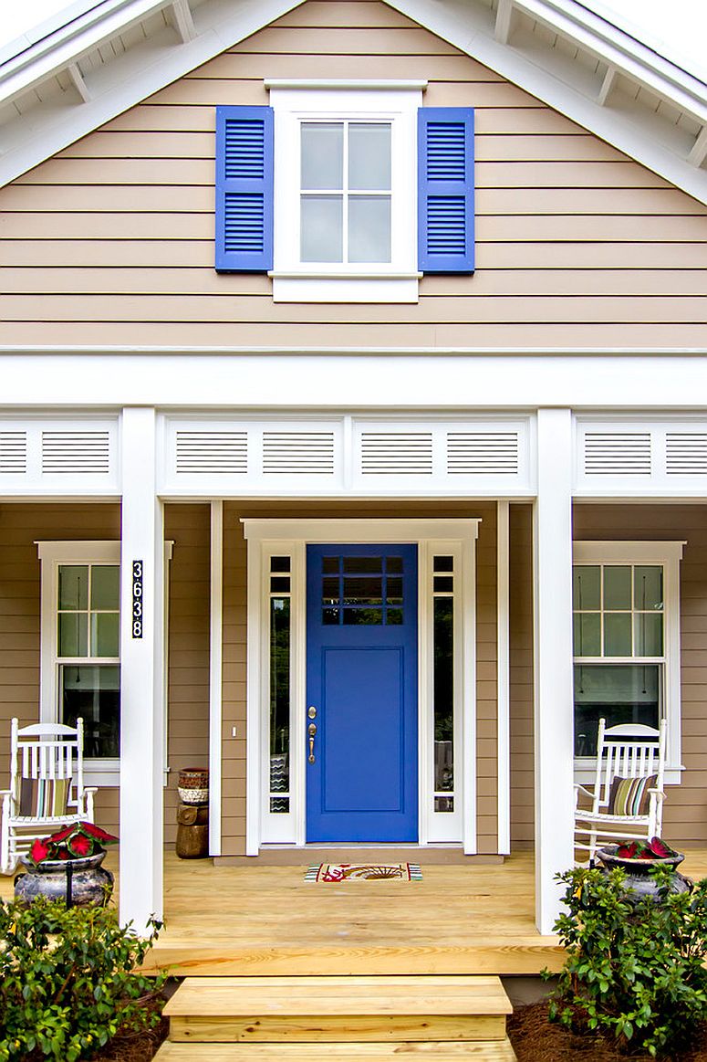 Window-shutters-above-add-to-the-charm-of-the-blue-door-used-for-this-beach-house