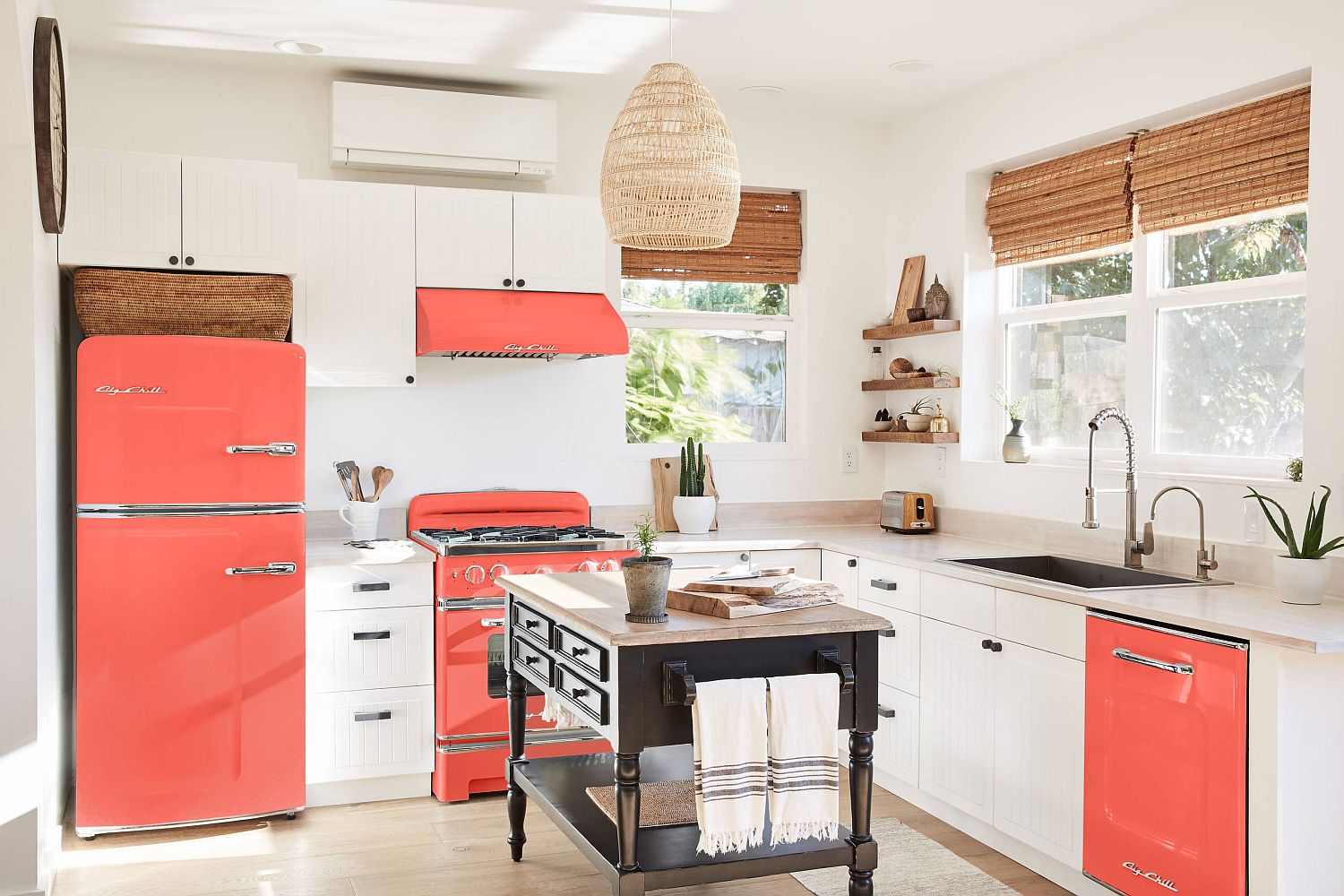 Appliances bring orange to this kitchen in white