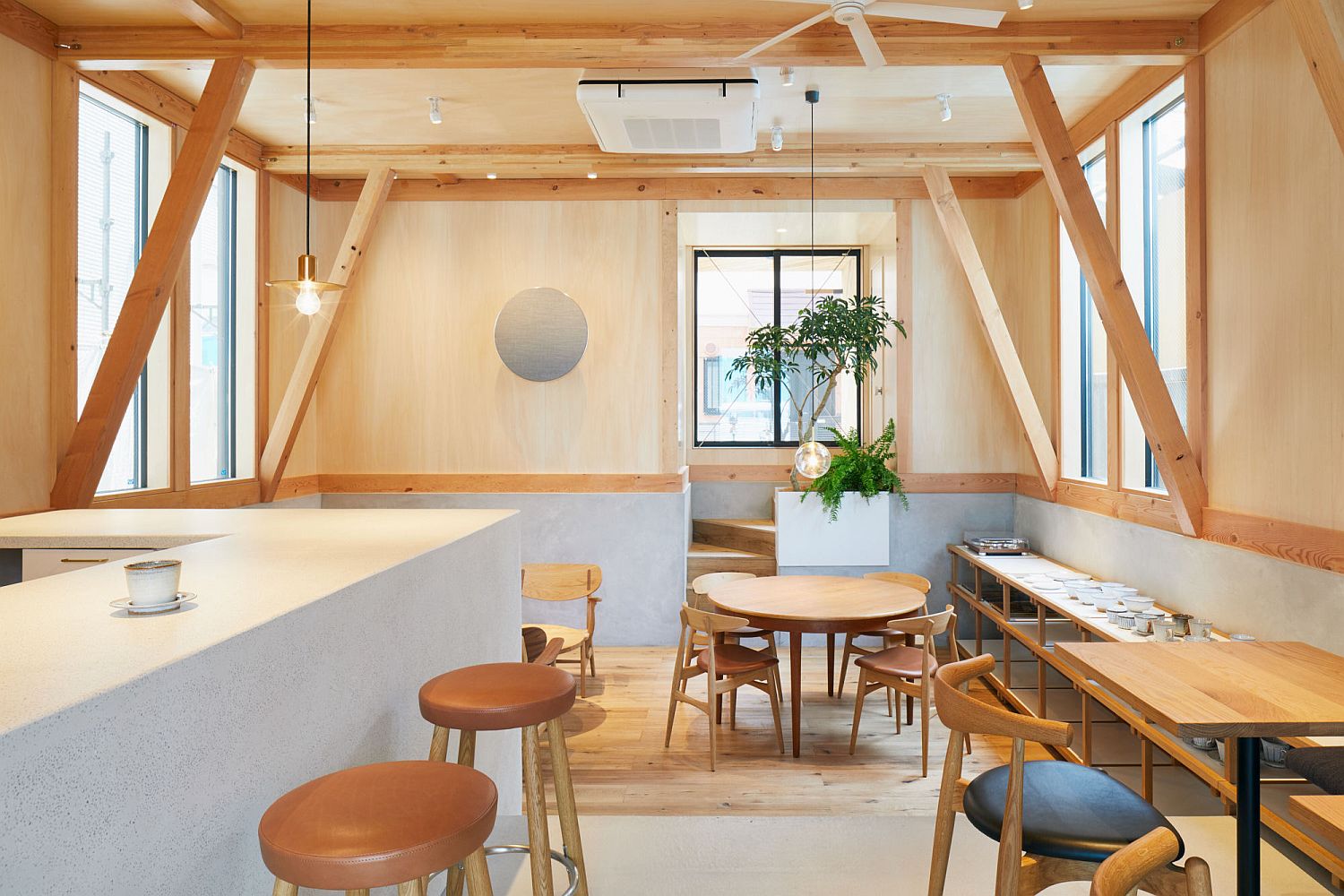 Modern Japanese Café with a Cozy Residence Above Makes a Woodsy