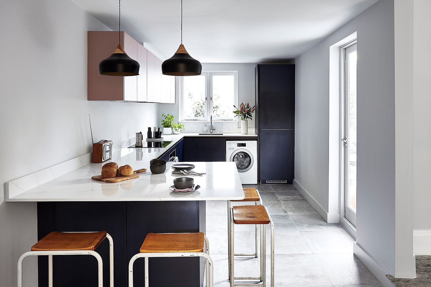 Delightful black pendants stand out visually when placed against the light, neutral backdrop