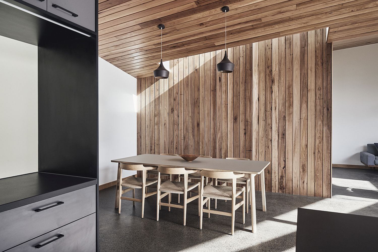 Dining room with wooden walls, ceiling and gorgeous contemporary lights