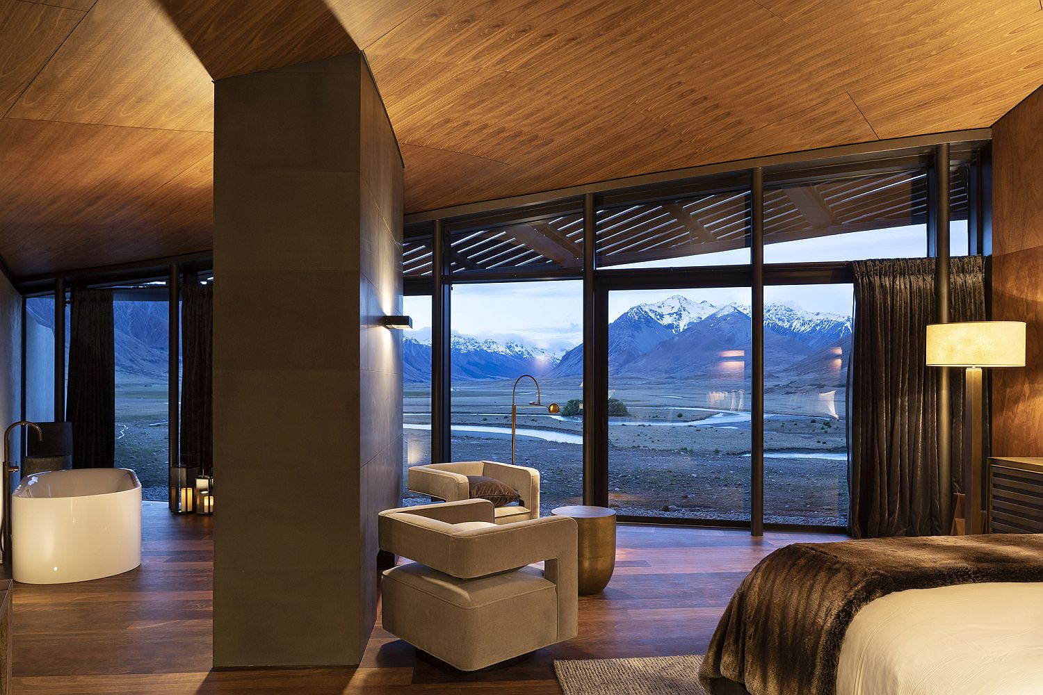 Glass doors and windows blur the line between the interior and the outdoors