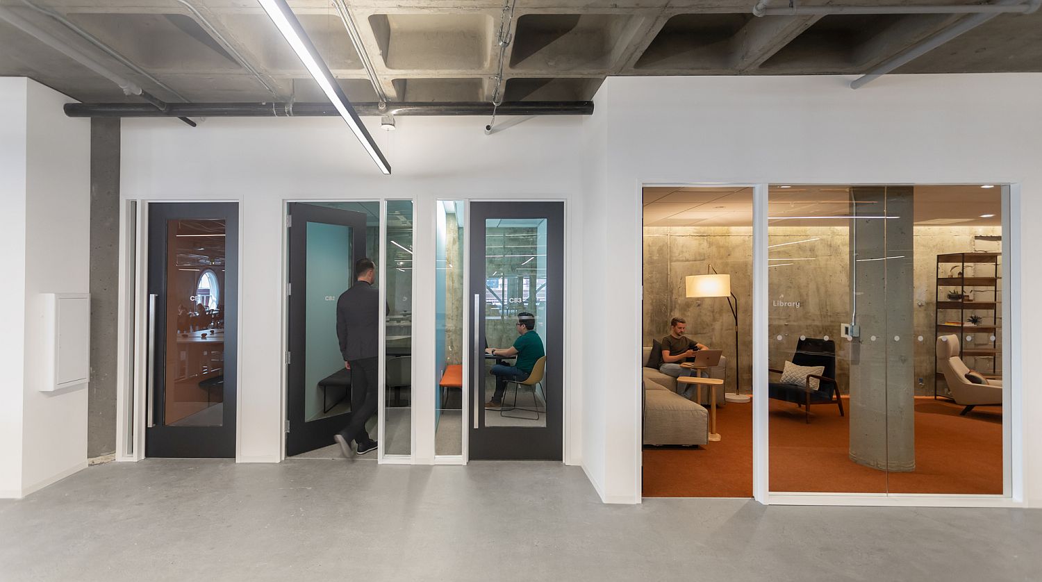 Glass walls connect the private workspace with the larger workzone