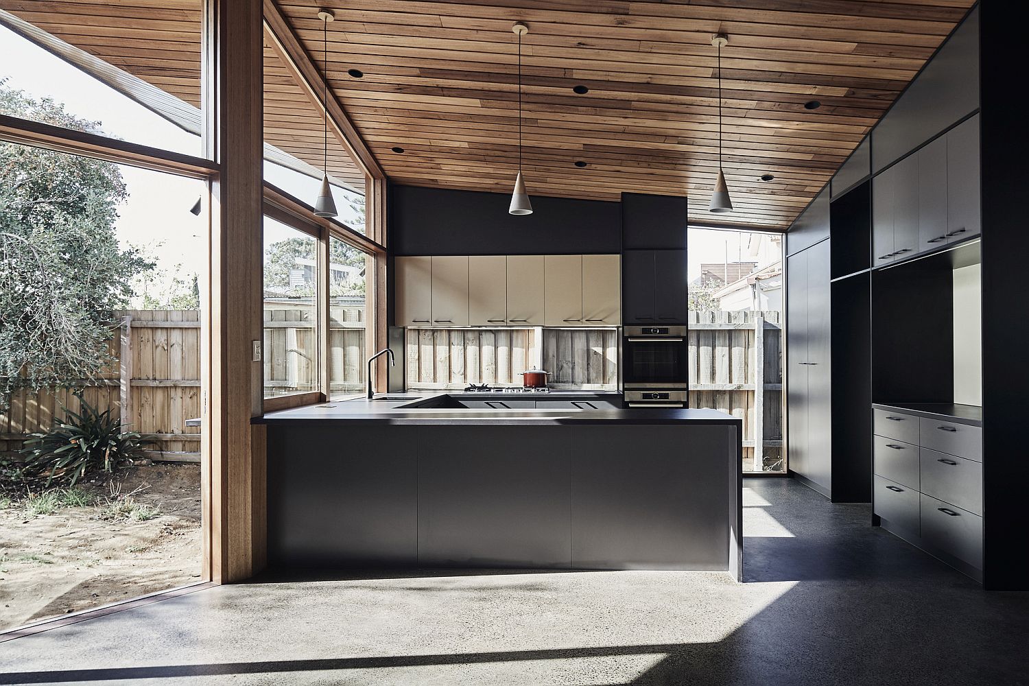 Gray kitchen that opens up to the outdoors with ease