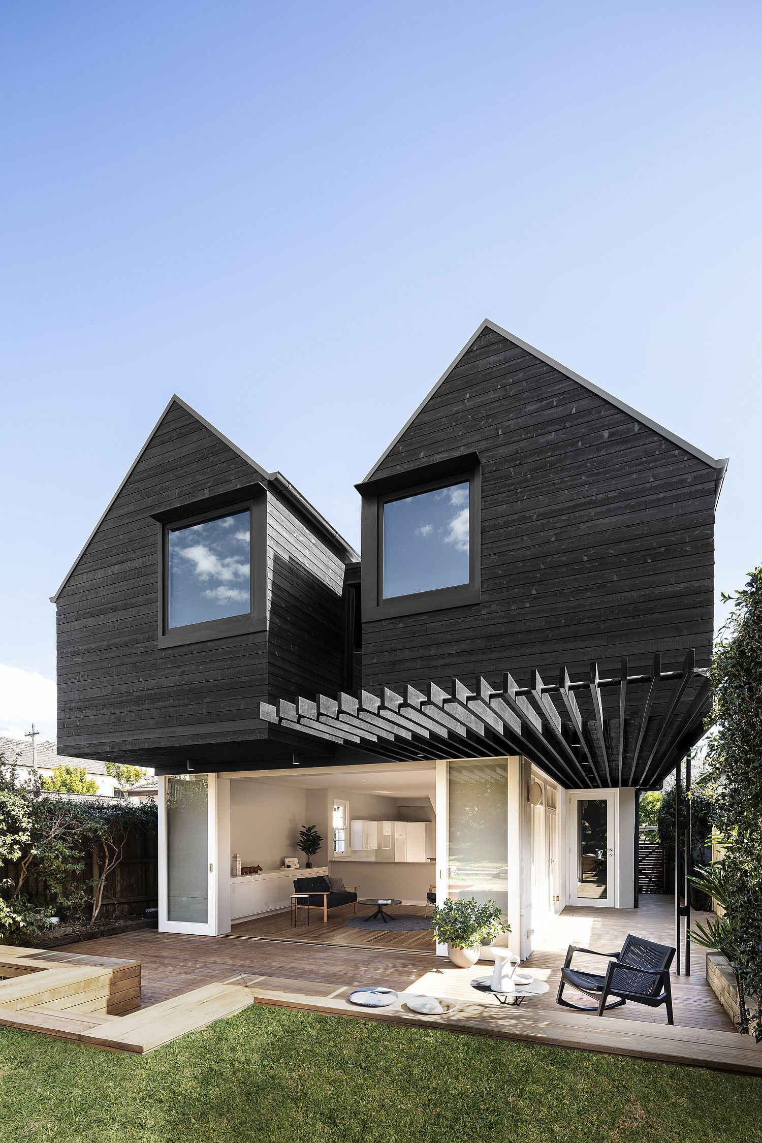 Black Twin Peaks Cottage Style Structure in the Rear Extends Aging Aussie Home
