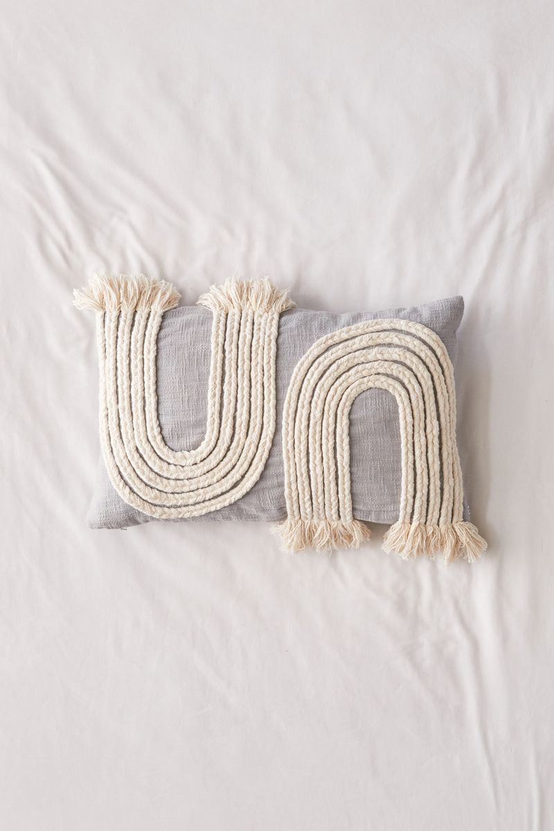 Pillow with braided accents