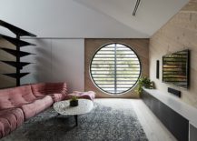 Round-window-and-plush-pink-sofa-add-a-different-dynamic-to-the-room-217x155