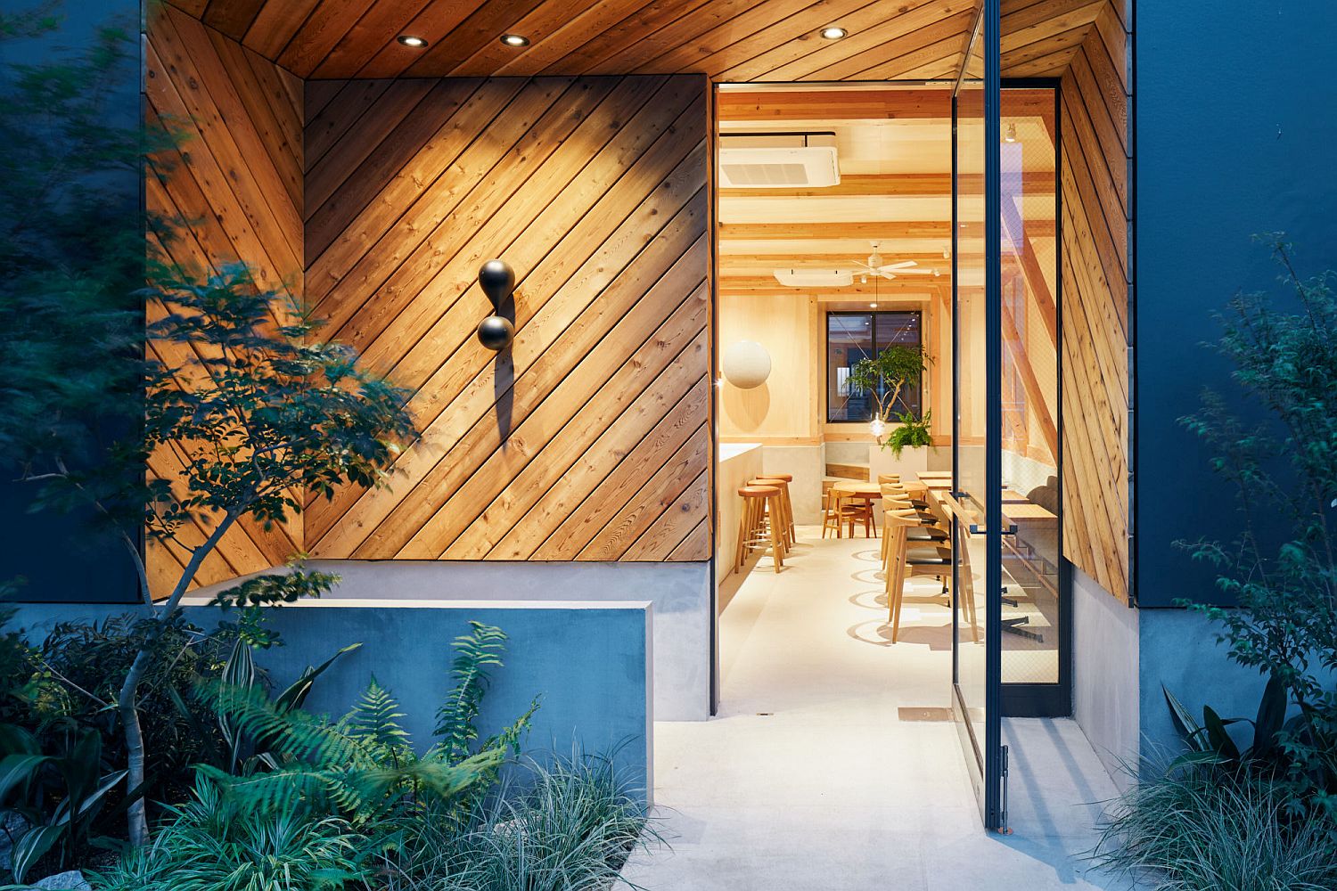 Modern Japanese Cafe With A Cozy Residence Above Makes A Woodsy Impression