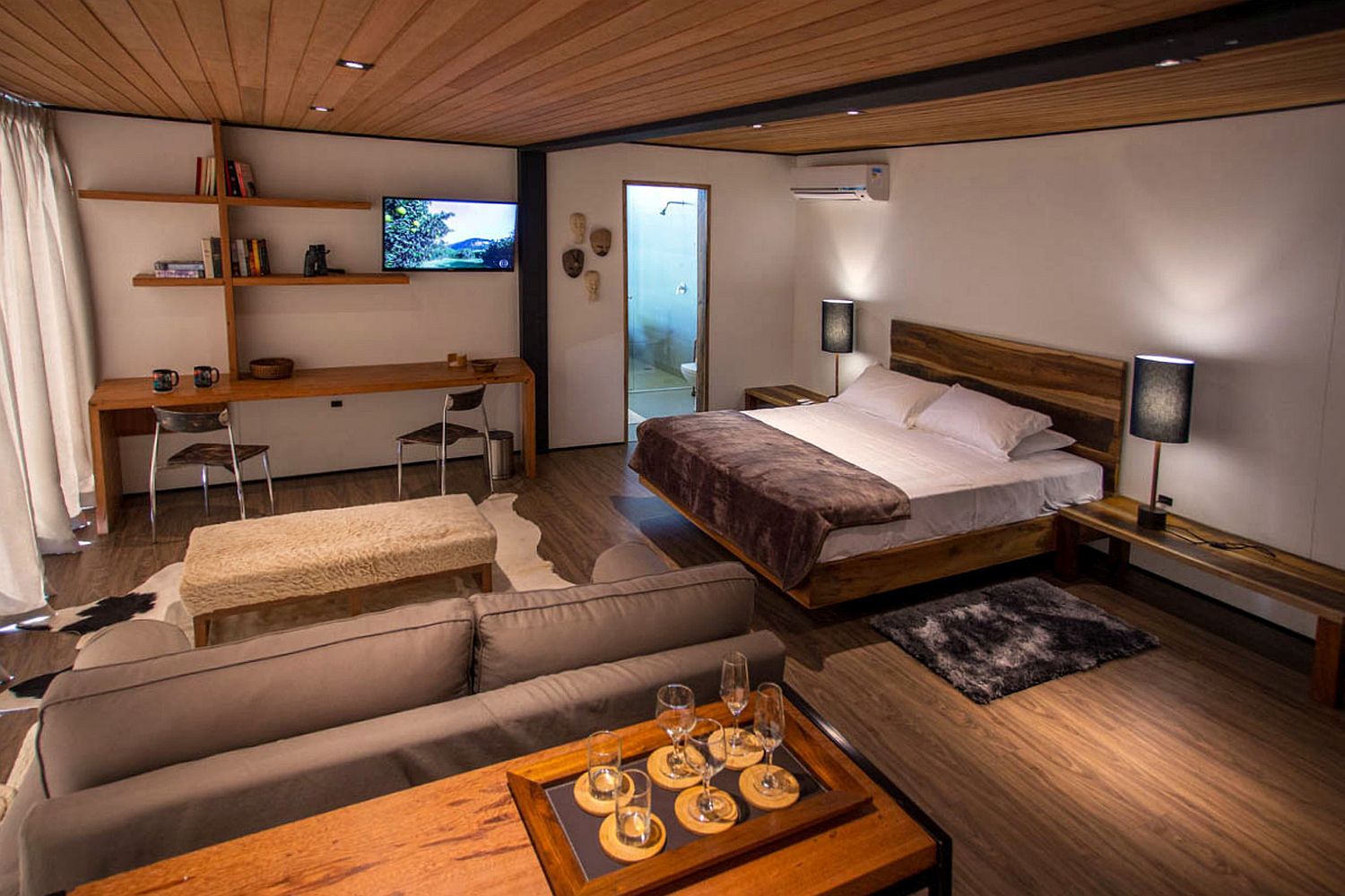 Small-cabin-interior-with-a-nifty-living-area-and-bedroom