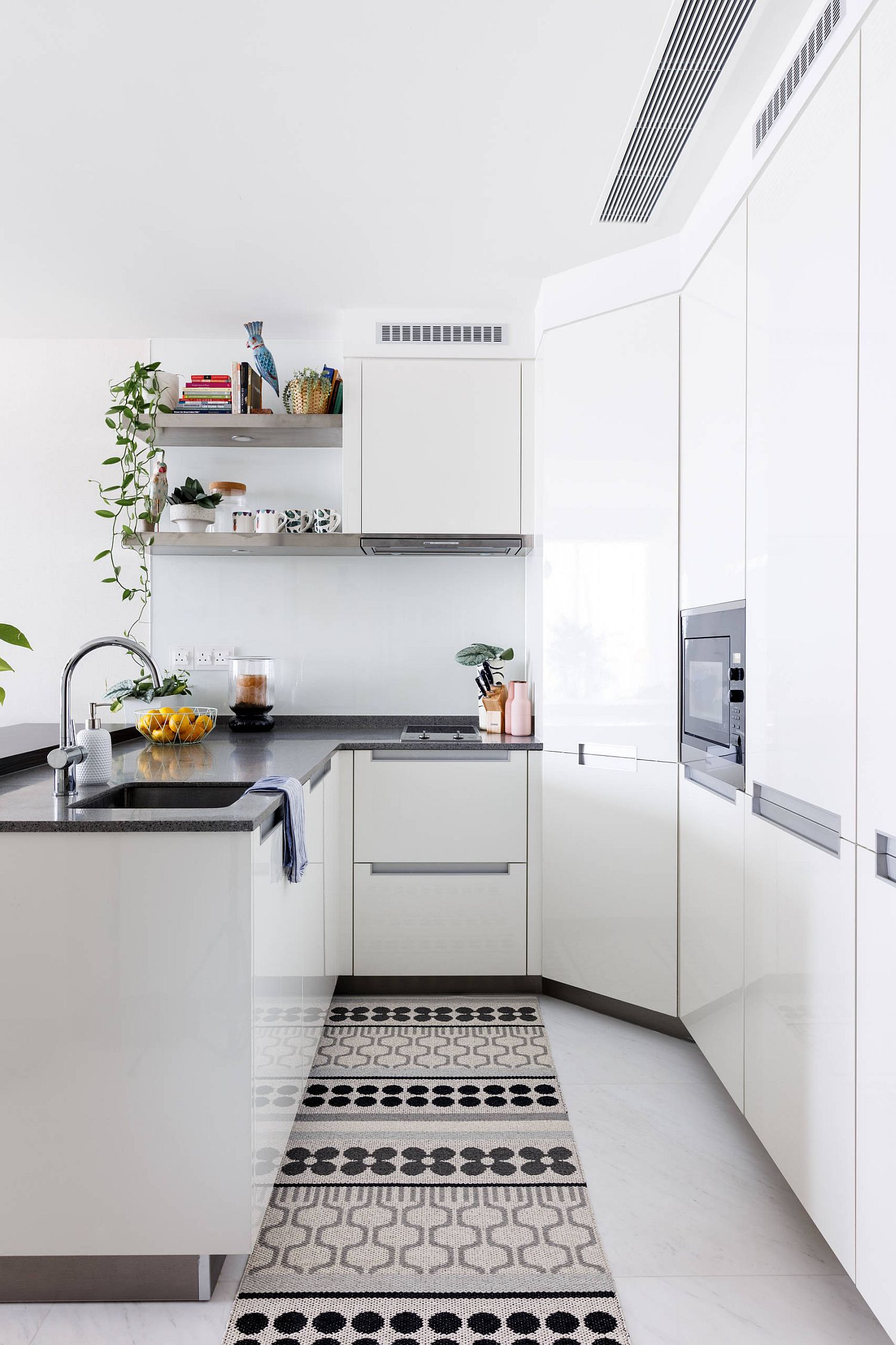 Space-savvy tiny kitchen in white with modern Scandinavian style