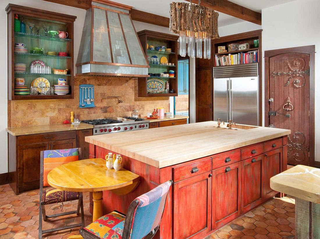 Stunning orange kitchen island steals the show in this Mediterranean style kitchen