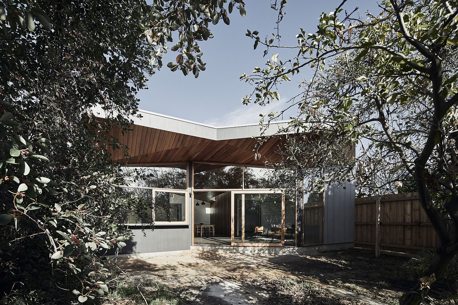 Trees offer shade to the exterior of the house