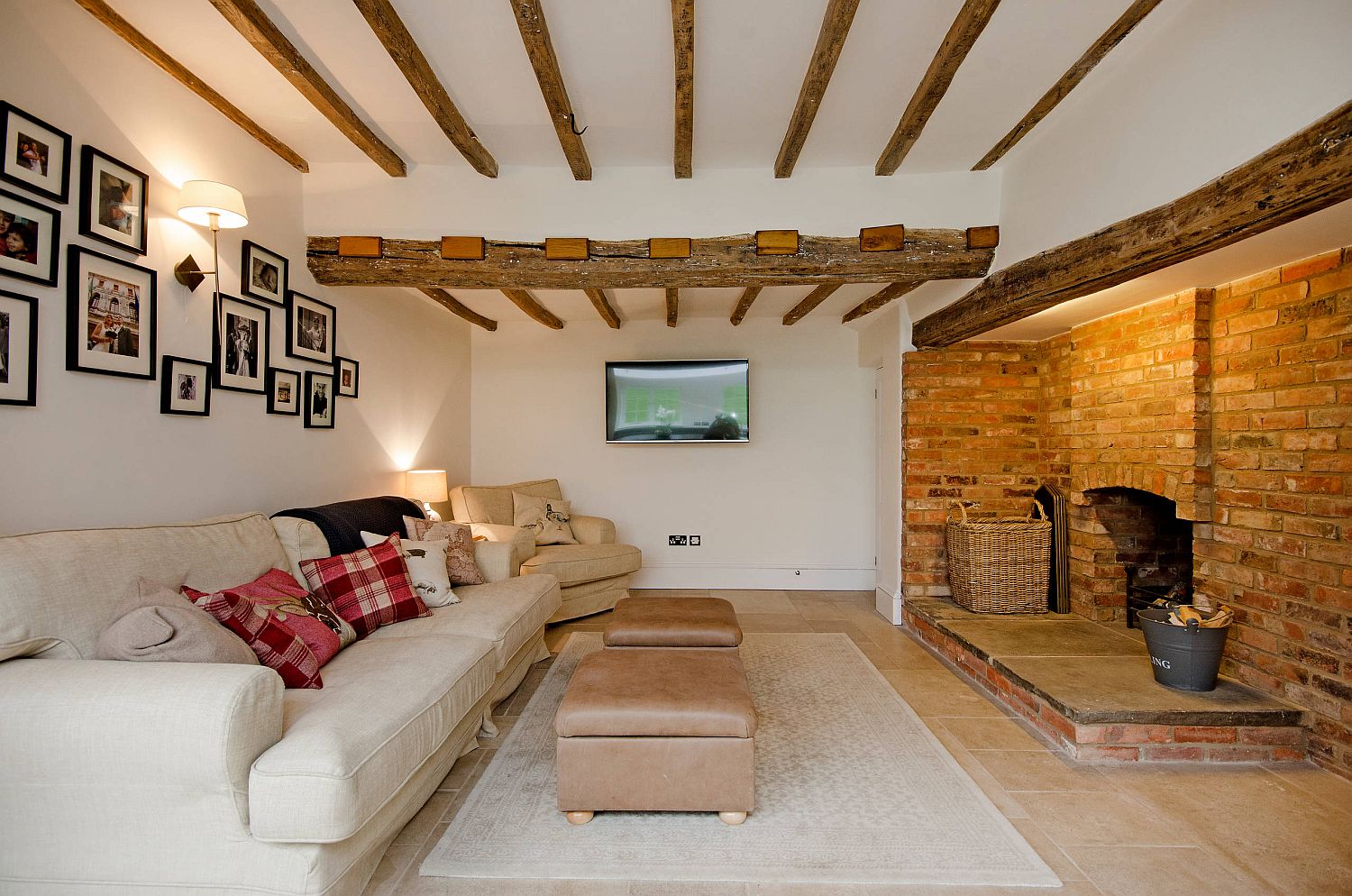 Living room with wooden ceiling beams.