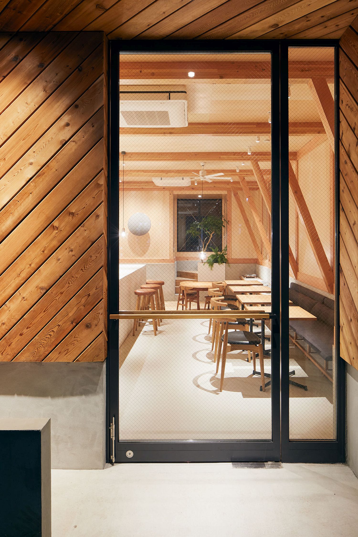 View-from-outside-of-the-cafe-shaped-in-wood-and-terrazo