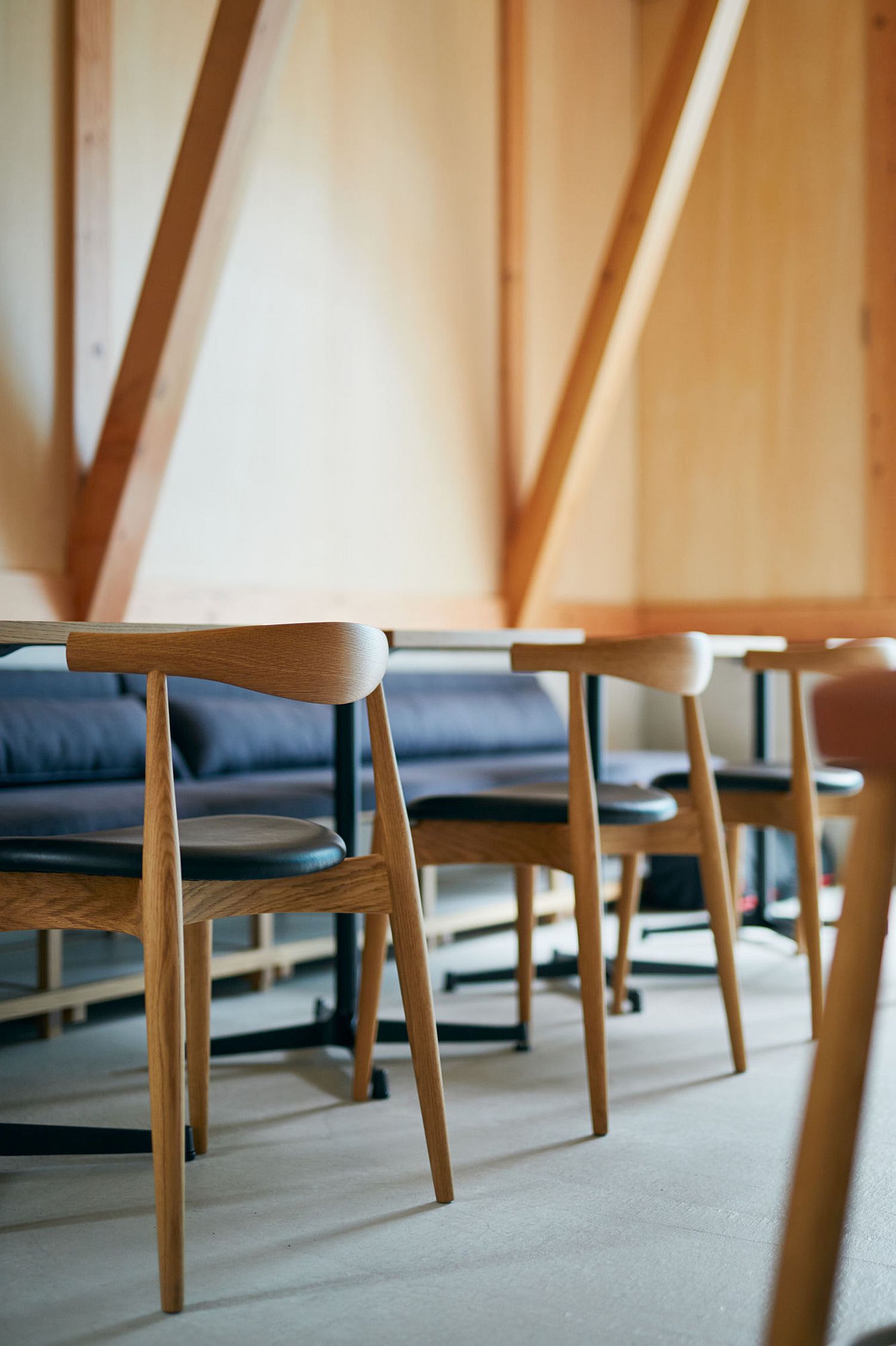 Wooden stools inside the cafe add to its minimal Japanese style