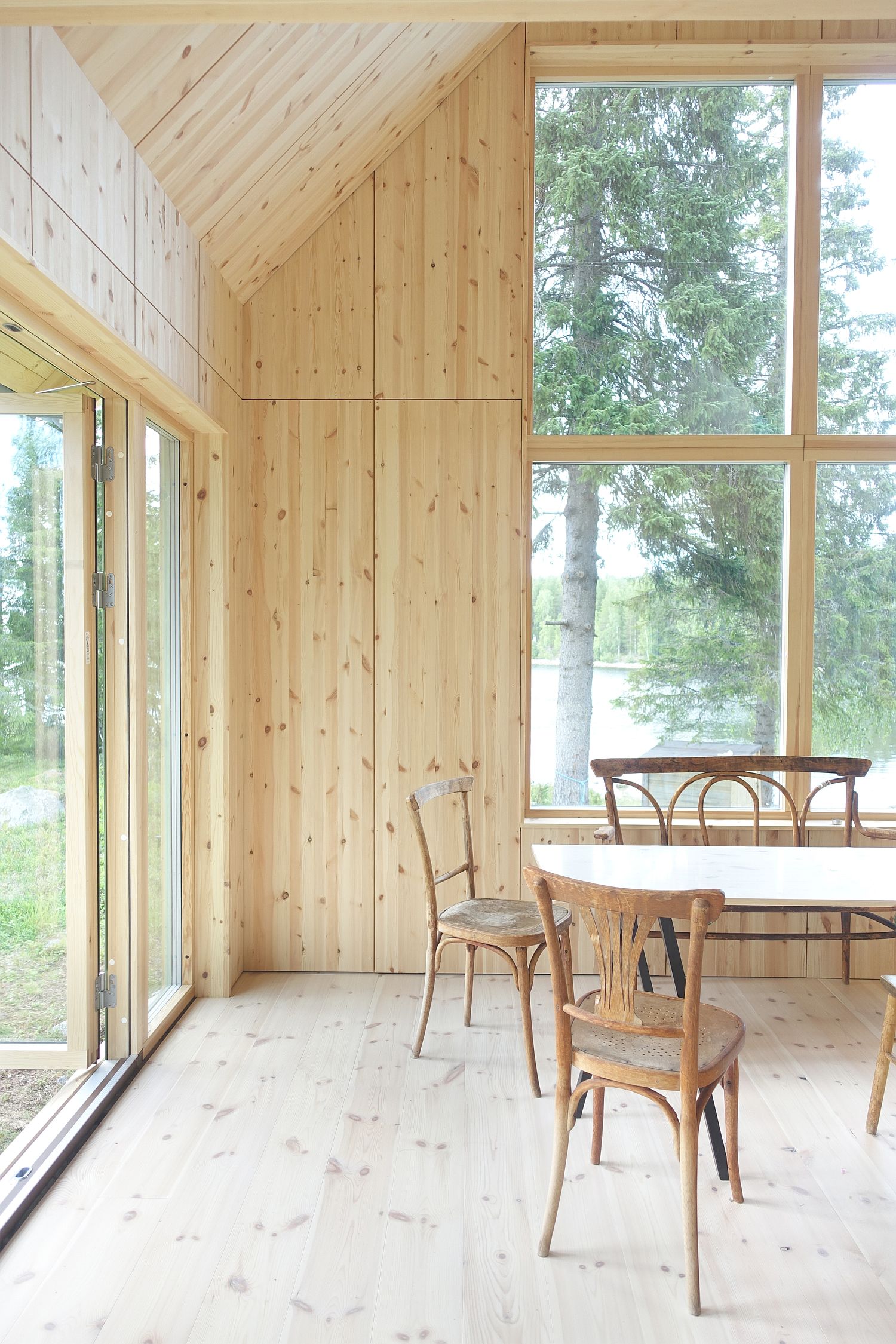 Woodsy and Scandinavian style interior of the stylish Sweden summer cabin