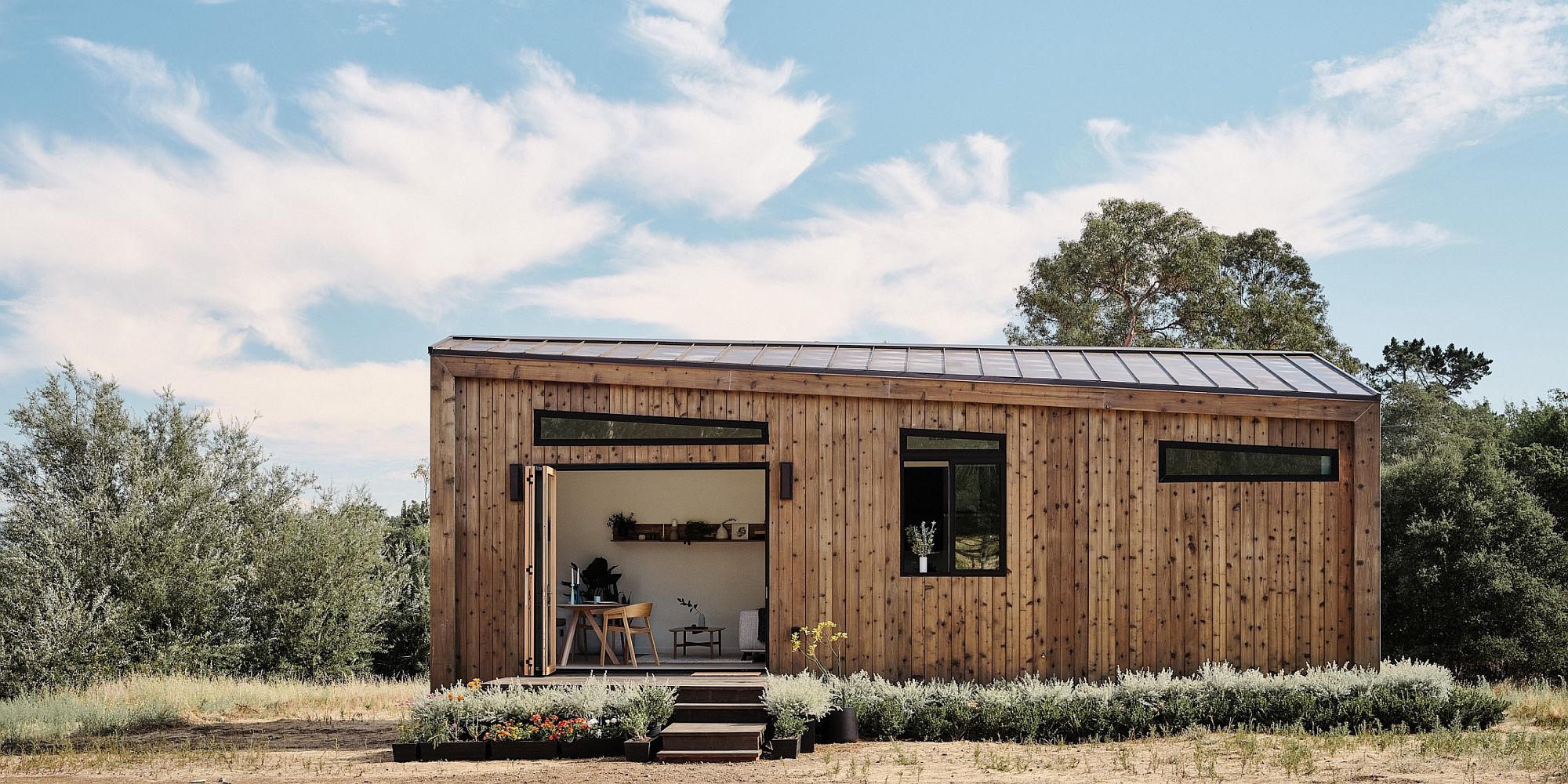 Backyard tiny house in wood offers smart living solutions in limited space