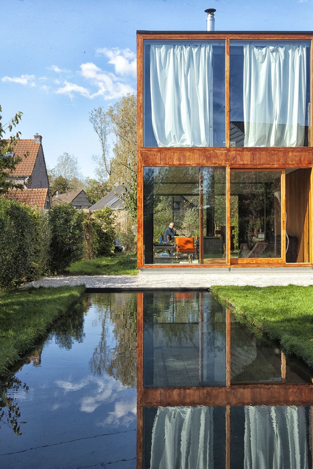 Minimal Concrete, Steel and Glass Home Wrapped in Cloak of Greenery