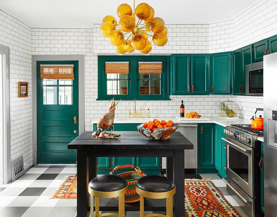 Beautiful eclectic kitchen of Chicago home in white with dark green cabinets