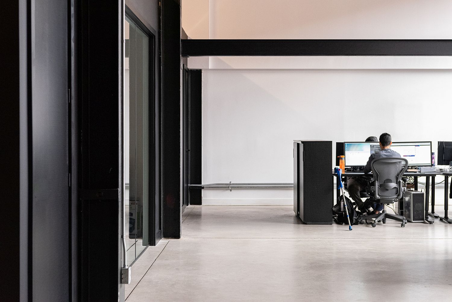 Black anchors the open plan office space beautifully