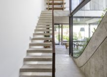 Concrete-staircase-with-steel-railing-leads-to-the-top-level-217x155