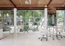 Framed-glass-walls-of-the-salon-connect-the-interior-with-the-world-outside-217x155