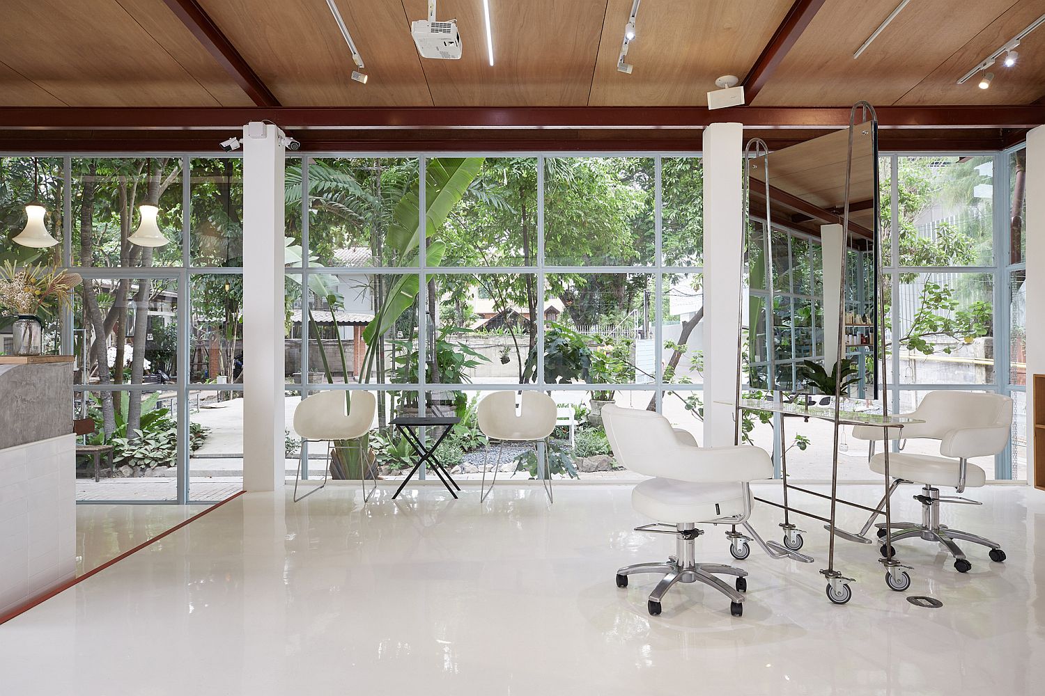 Framed-glass-walls-of-the-salon-connect-the-interior-with-the-world-outside