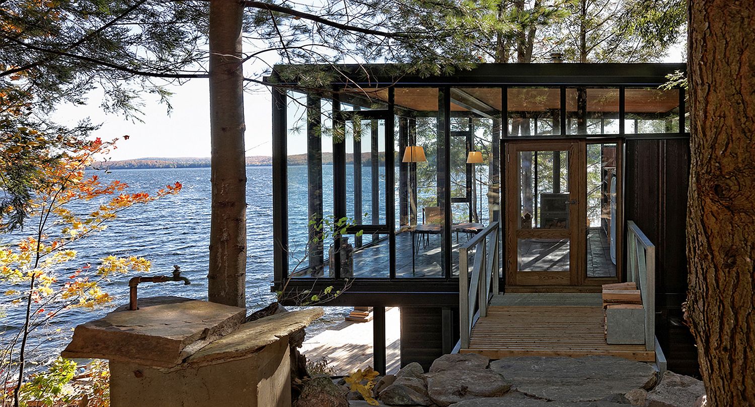 Glass walls create a setting that feels natural and magical inside the lakeside home