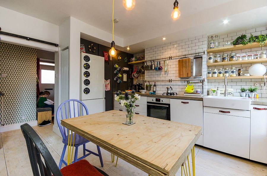 Industrial touches illuminate this small eclectic kitchen of London home