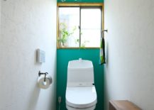Narrow-powder-room-with-a-striking-accent-wall-in-dark-green-217x155