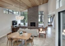 Open-plan-living-area-with-lovely-fireplace-and-gable-roof-217x155