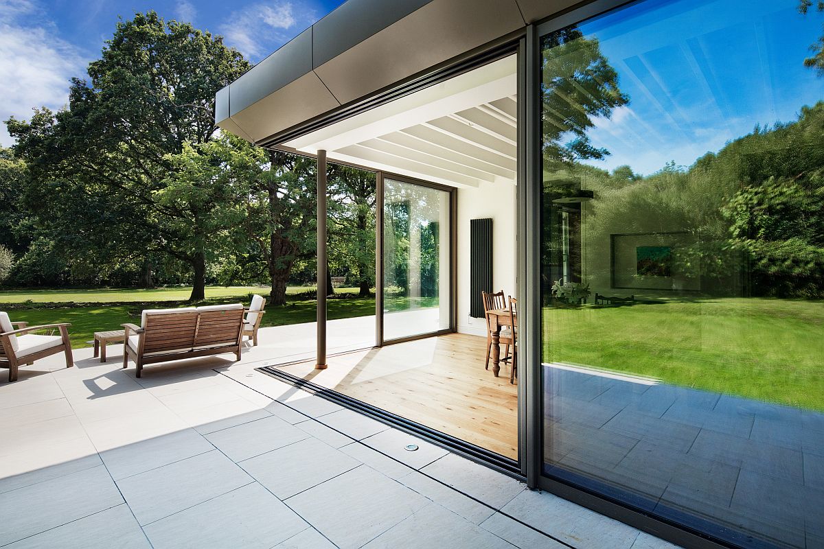 Open, white deck of the house extends the living area into the garden