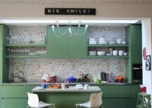 Painted-cabinets-in-green-coupled-with-floating-shelf-sections-in-the-single-wall-eclectic-kitchen-217x155