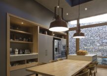 Pendant-lights-hanging-from-the-double-height-dining-area-and-kitchen-217x155